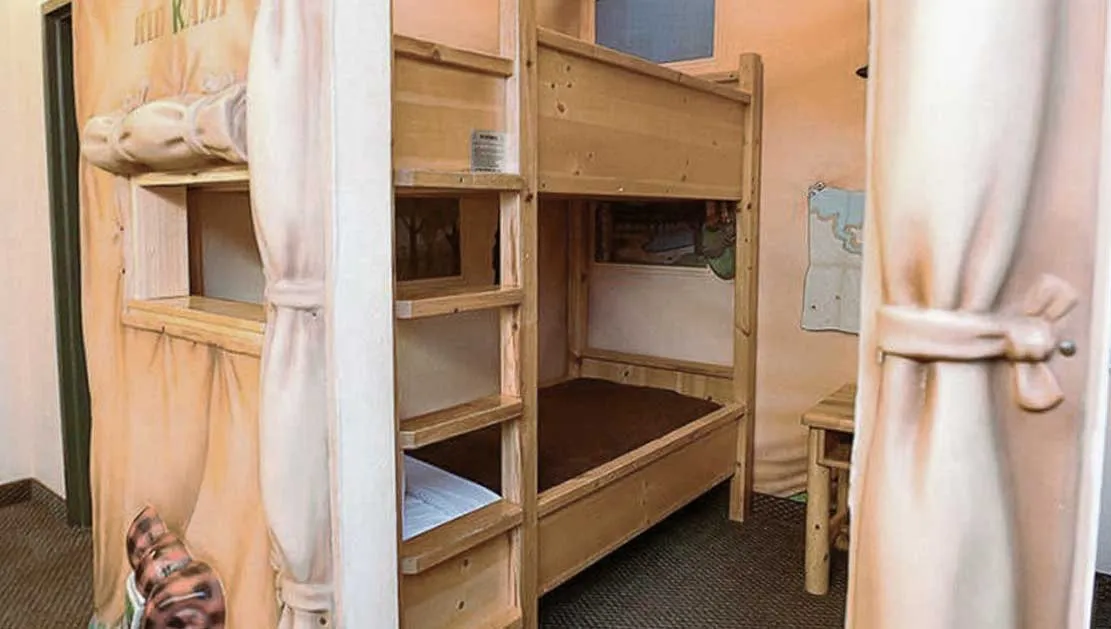 The bunk beds inside the indoor tent in the KidKamp Suite